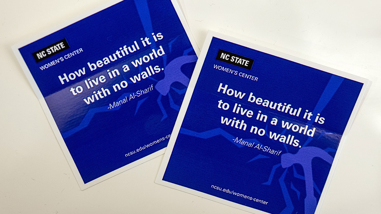 A sticker reads "How beautiful it is to live in a world with no walls."