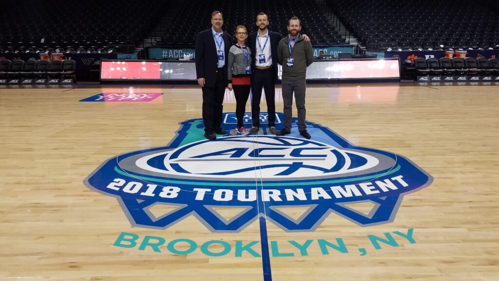 The four members of the Kivett family standing at center court for the 2018 ACC Tournament in Brooklyn, New York.
