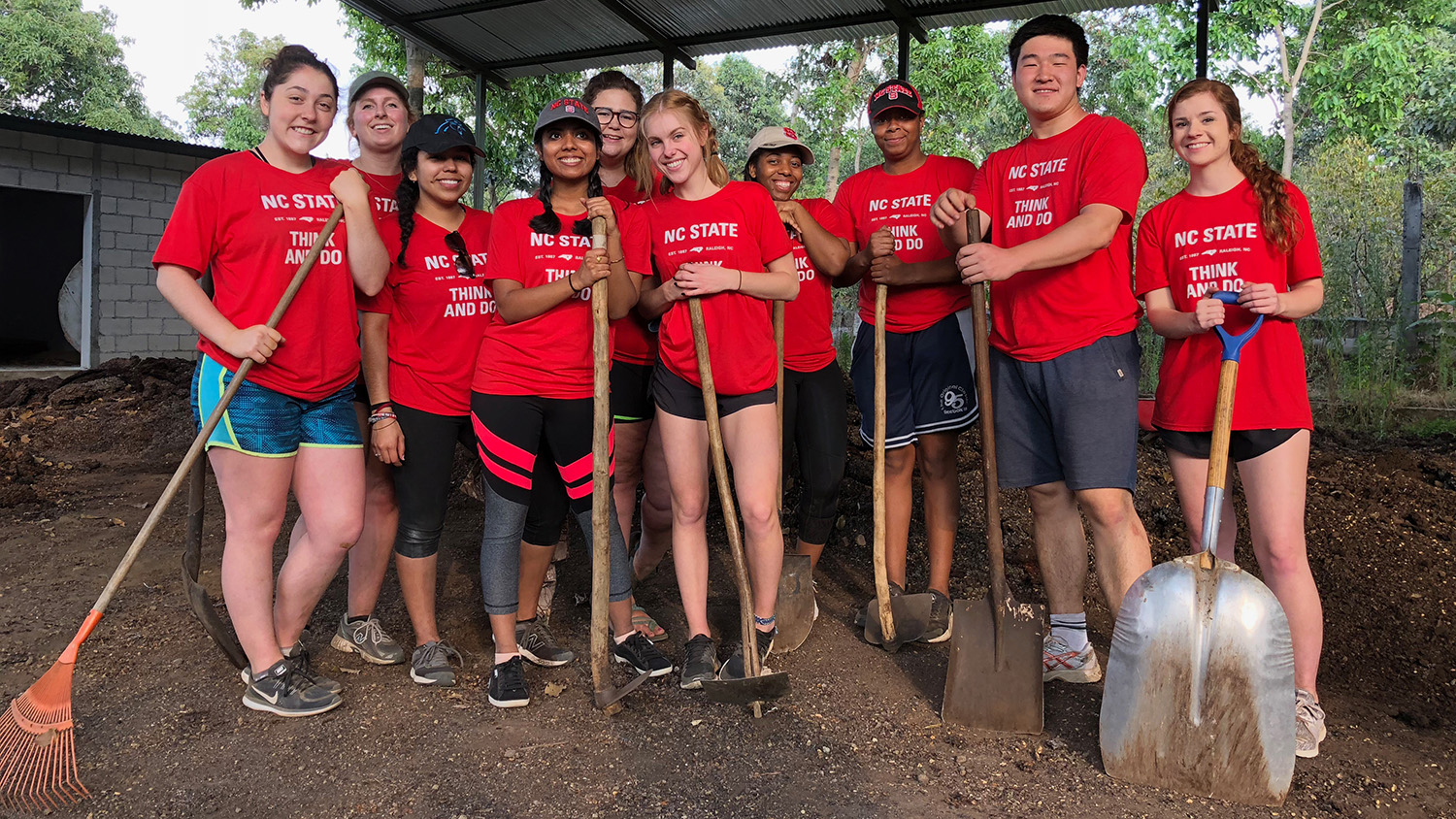 ASB students on a trip to Guatemala grab their shovels and get ready to work.