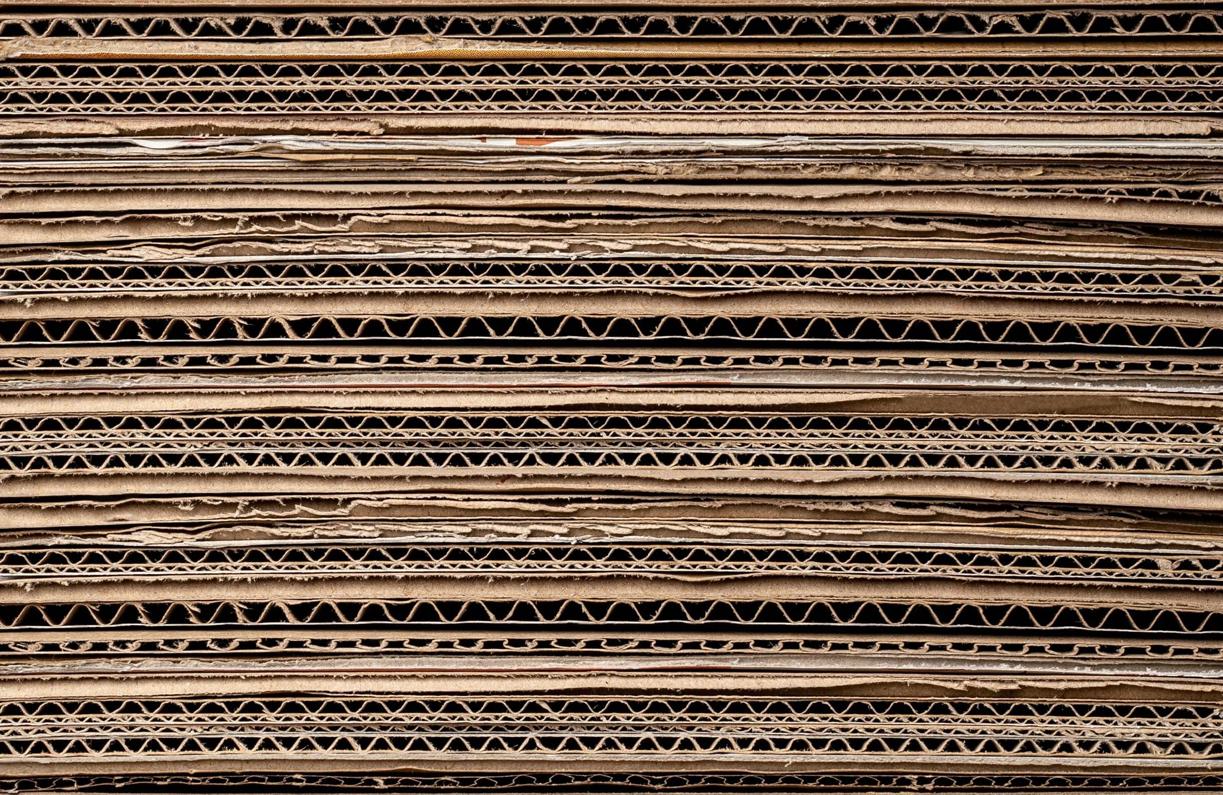 flattened cardboard boxes stacked on top of each other