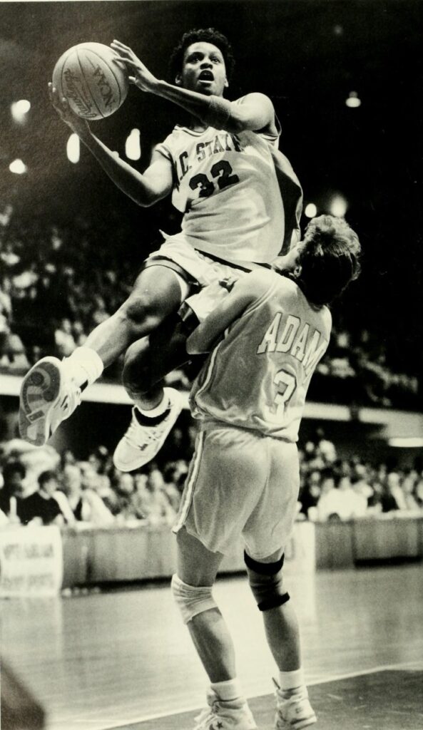 Stinson goes up over a defender during a game at Reynolds Coliseum