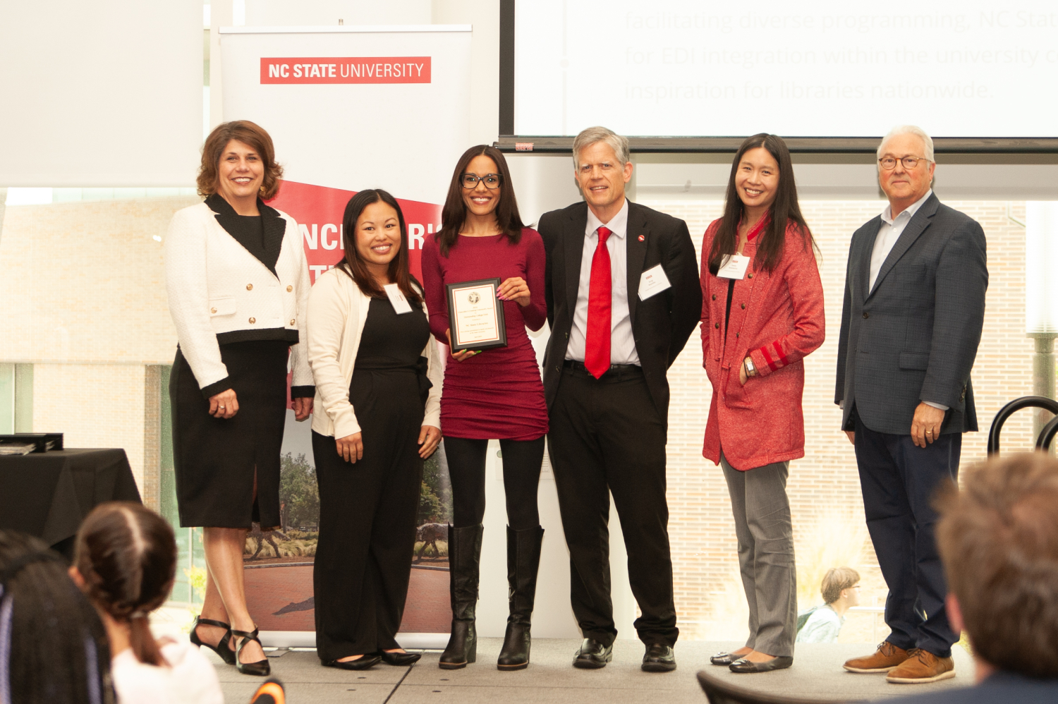 Sheri Schwab, Vice Provost for Institutional Equity and Diversity, and Chancellor Randy Woodson pose with RED Event winners on Tuesday.