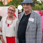 Susan Woodson poses beside Larry Bell, artist of Reds and Whites, at a dedication event for the Susan Woodson Plaza at Centennial Campus.