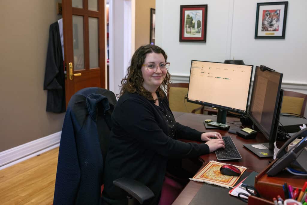 Thompson working in her office, at her desk in Holladay Hall. 