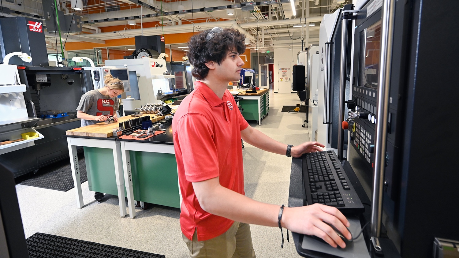 Two students work in the CAMAL lab on NC State's Centennial Campus.