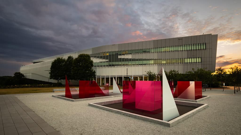 The Hunt Library at dusk. In the foreground is the Reds and Whites art installation.