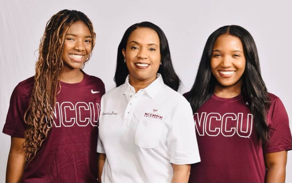 Dixon stands between her two daughers, Kamryn and Korryn, all three of whom are wearing North Carolina Central University apparel. 