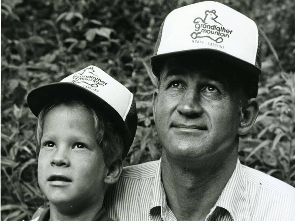 Kiffin and one his sons sporting Grandfather Mountain baseball caps. 