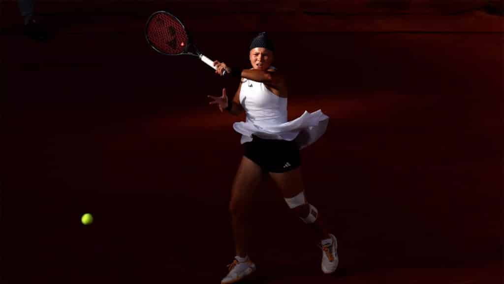 Diana Shnaider returns a serve during her Olympic tennis match