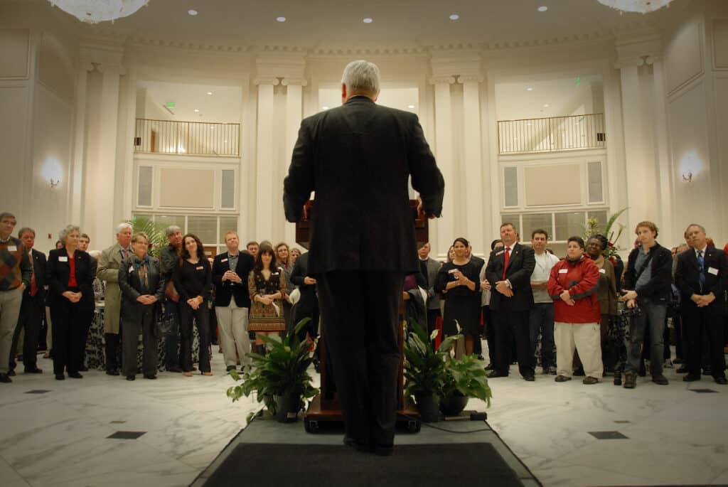 Woodson faces a crowd in Park Alumni Center during one of his first days on the job