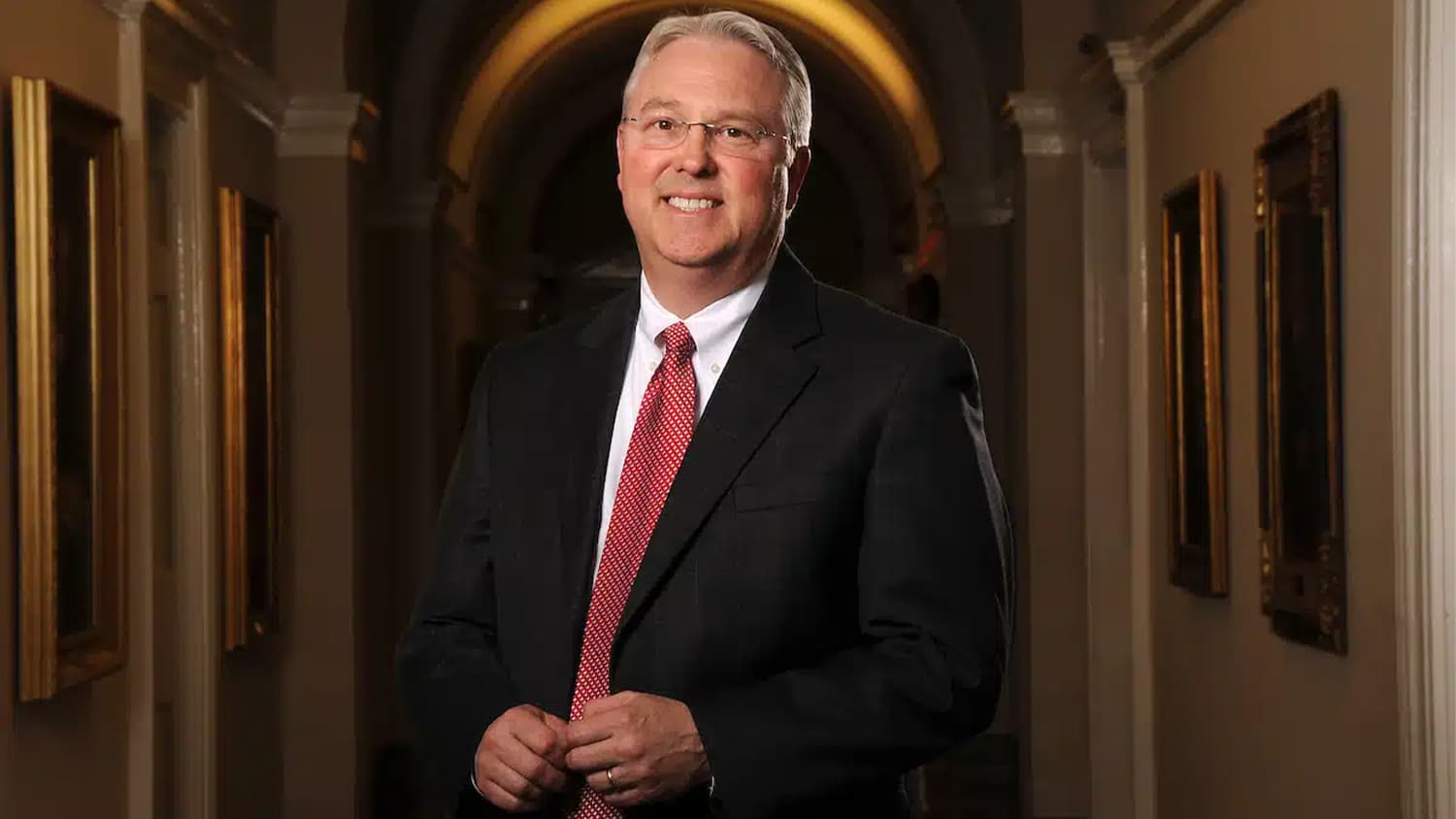 Chancellor Woodson standing in the hallway of Holladay Hall