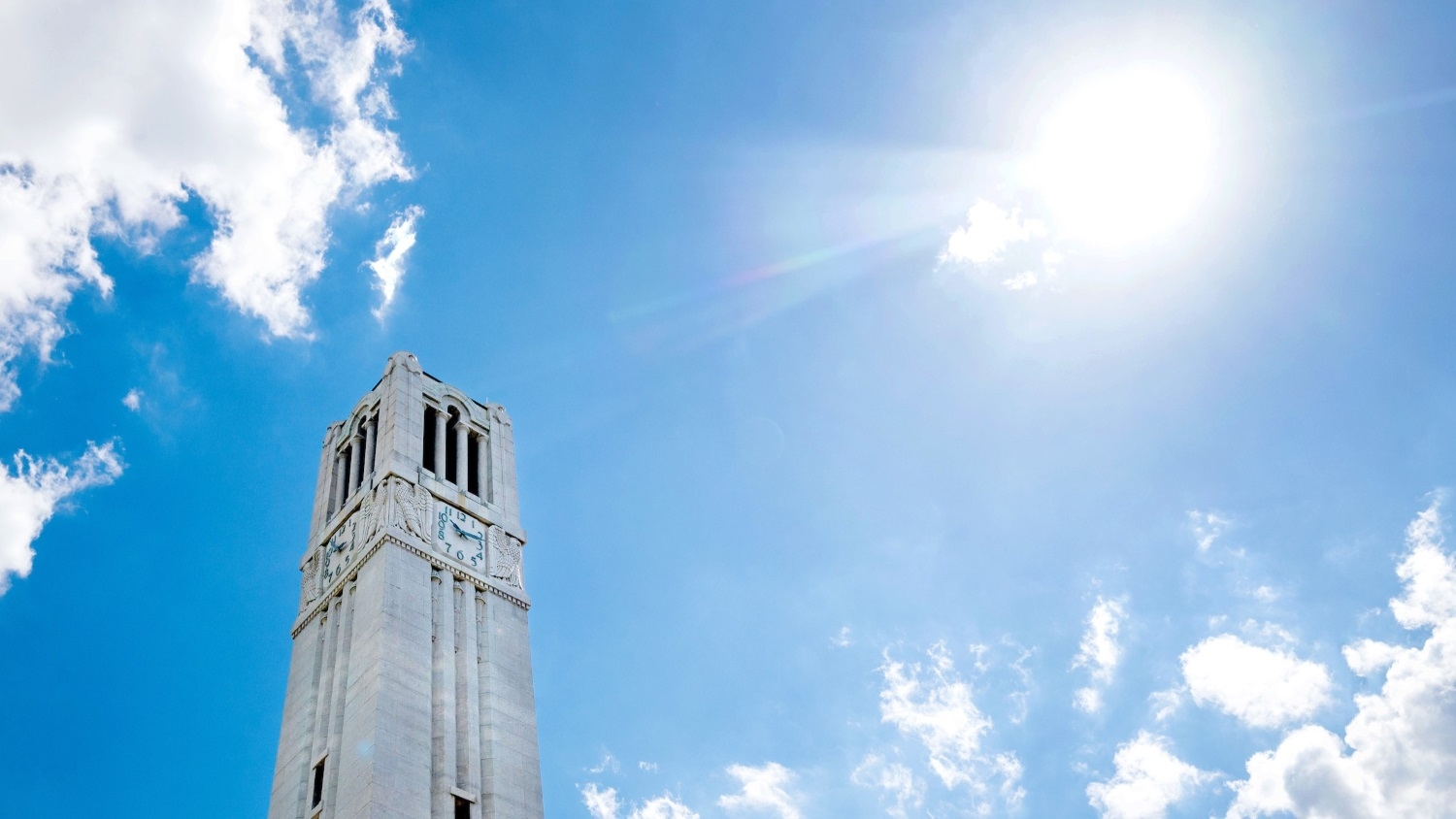 the summer sun shines over the Memorial Belltower