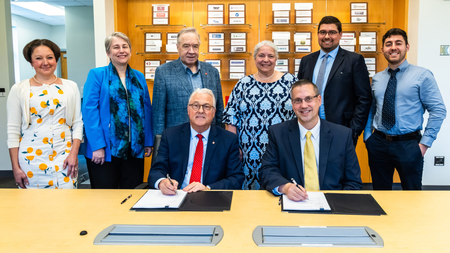 NC State Chancellor Randy Woodson and John D. Matyjas, scientific adviser to the commander of the U.S. Air Force’s Air Combat Command, signed an agreement between the two institutions to collaborate in areas like data science and artificial intelligence. NC State representatives, from left: Lori Wachter, Technical Program Manager, National Security and Special Research Initiatives, Office of Research and Innovation; Alyson Wilson, Interim Vice Chancellor for Research and Innovation; Mladen Vouk, Vice Chancellor for Research Emeritus; Randy Woodson, Chancellor. Air Combat Command visitors, from left: Cristina “Mona” Stone, Technical Advisor of the ACC Directorate of Intelligence’s Intel Data and Technology Futures Division; John Matyjas, Scientific Adviser to the Commander; Shelton Jacinto, Air Force Research Laboratory Liaison; Luis Monroig, Data Scientist. Photo by Jiyoung Park.