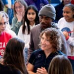 Astronaut and NC State alum Christina Koch chats with College of Sciences and Engineering students after a fireside chat session at the Riddick Hearth during Red and White Week 2023.