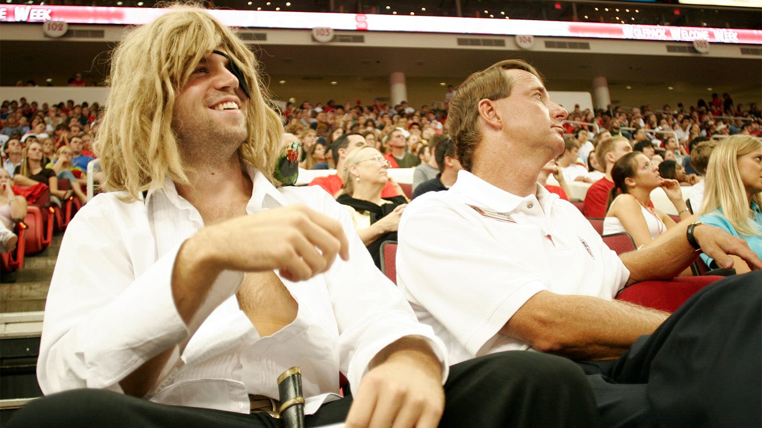 Whil Piavis, AKA The Pirate Captain, watches a sporting event from the stands in Reynolds Coliseum