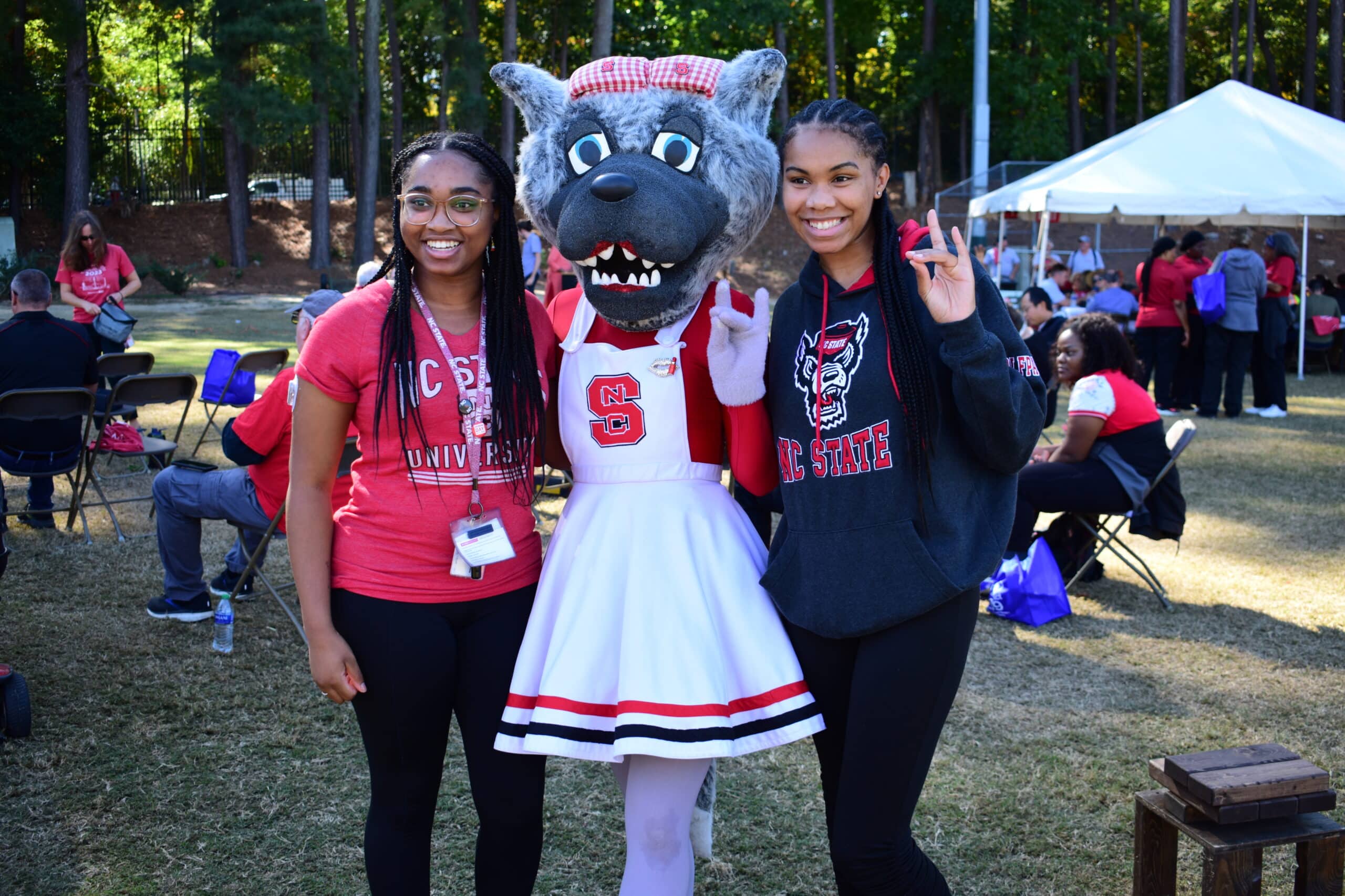 Employees pose with Mrs. Wuf