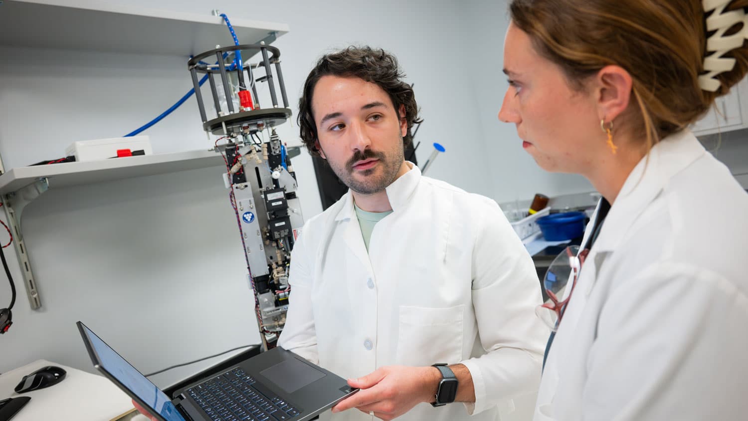 Will McClure and Barrett Rose with the Imaging Flow Cytobot in Professor Astrid Schnetzer's lab.