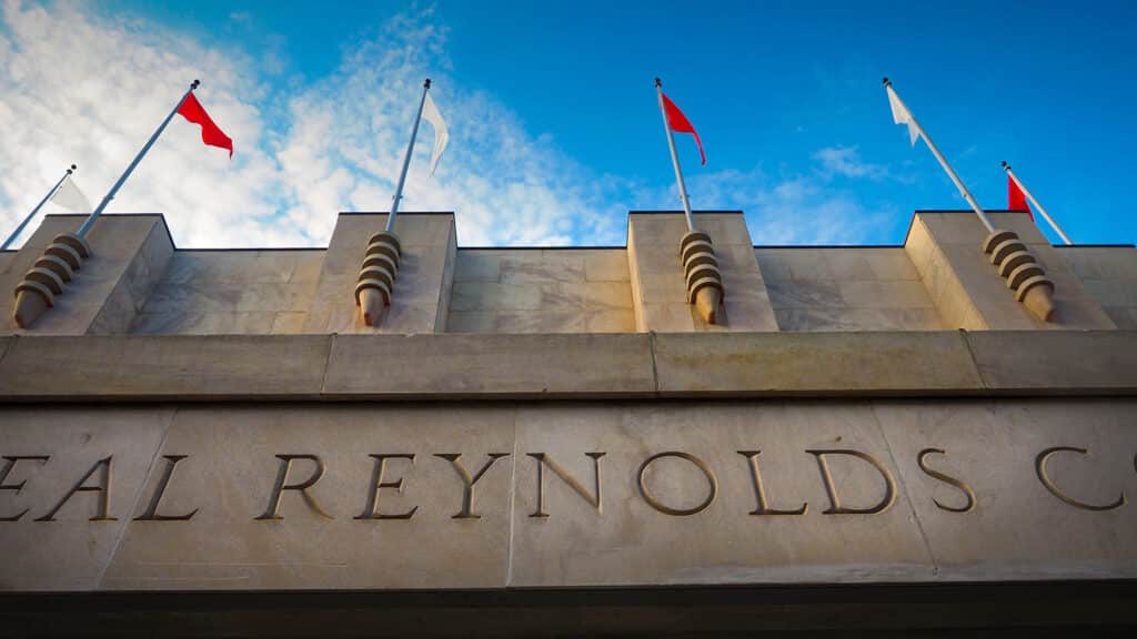 A close-up of the word "Reynolds" engraved in the side of Reynolds Coliseum