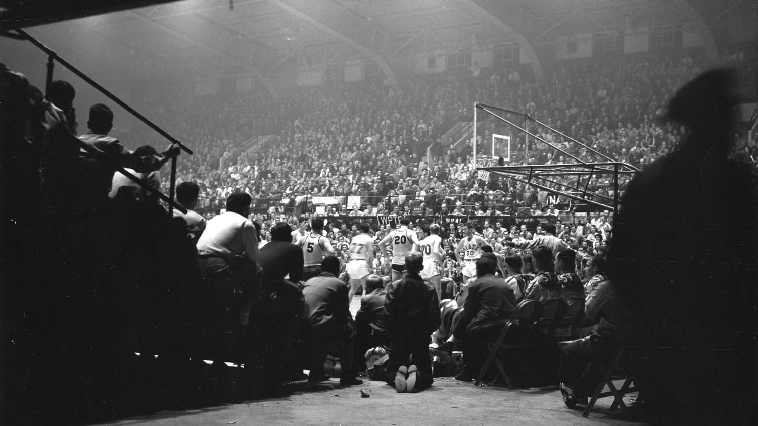 People in the stands of Reynolds Coliseum for the first basketball game in 1949