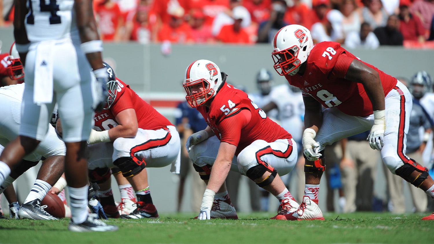 Joe Thuney (center, number 54) gets set for a play during a game at NC State.