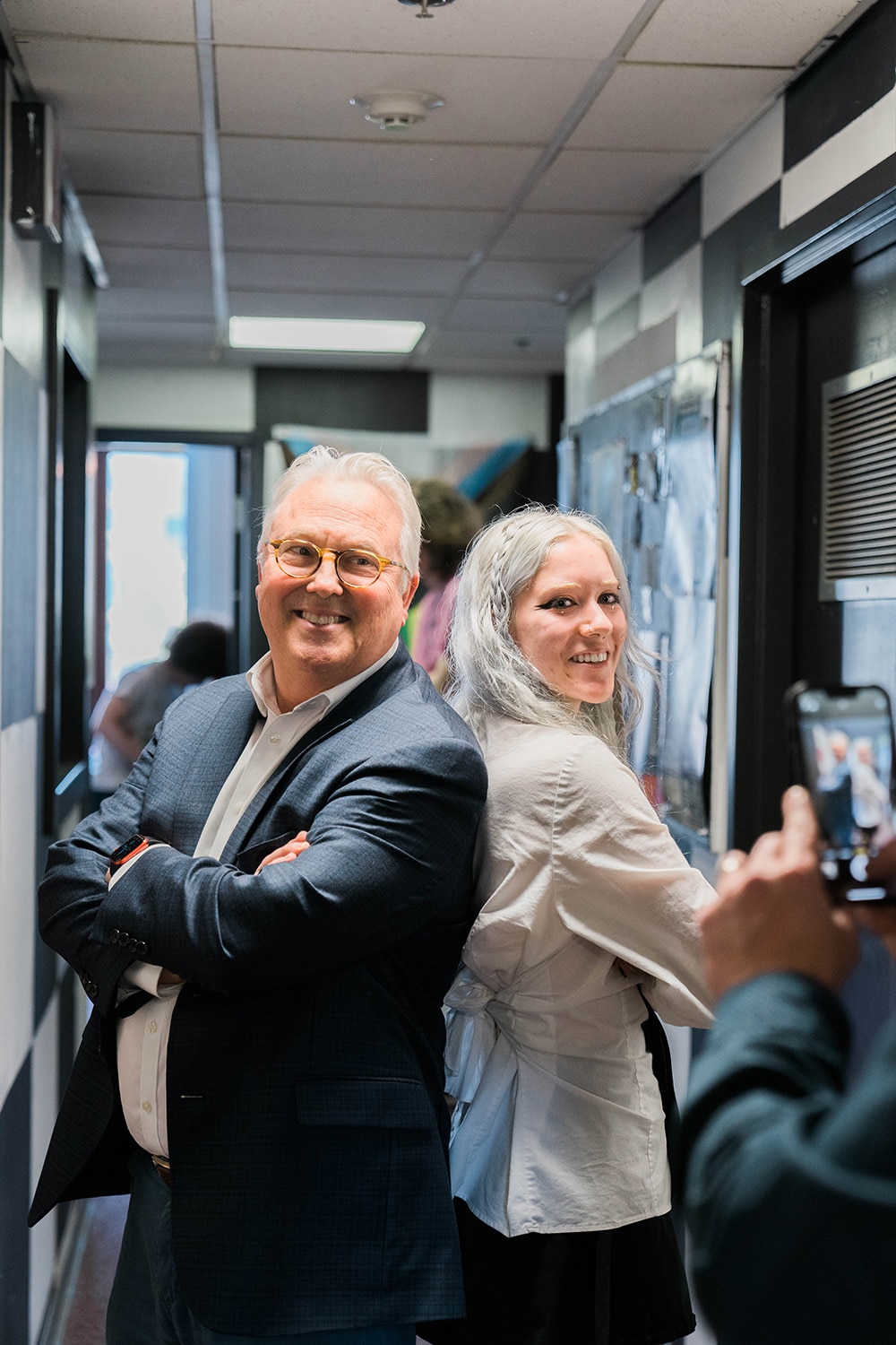 Chancellor Woodson poses for a photo with a student outside the WKNC radio station.