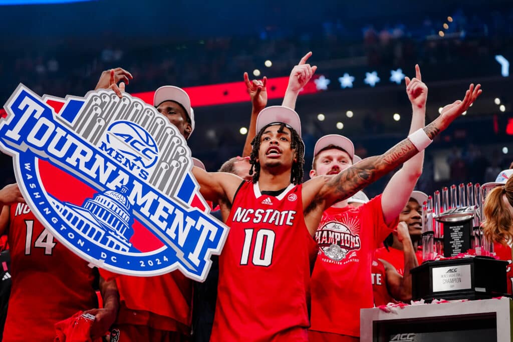 Breon Pass celebrates with his teammates after winning the 2024 ACC Tournament.