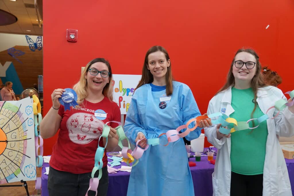 From left, Lisa Metzger, Tess Overton and Jade Hardwick received an honorable mention for their RNA CodeBreakers exhibit.