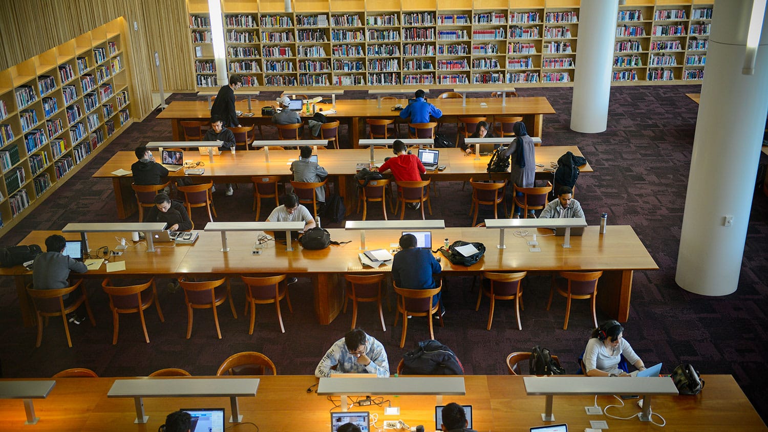 Students study at tables in the James B. Hunt Jr. Library at NC State.