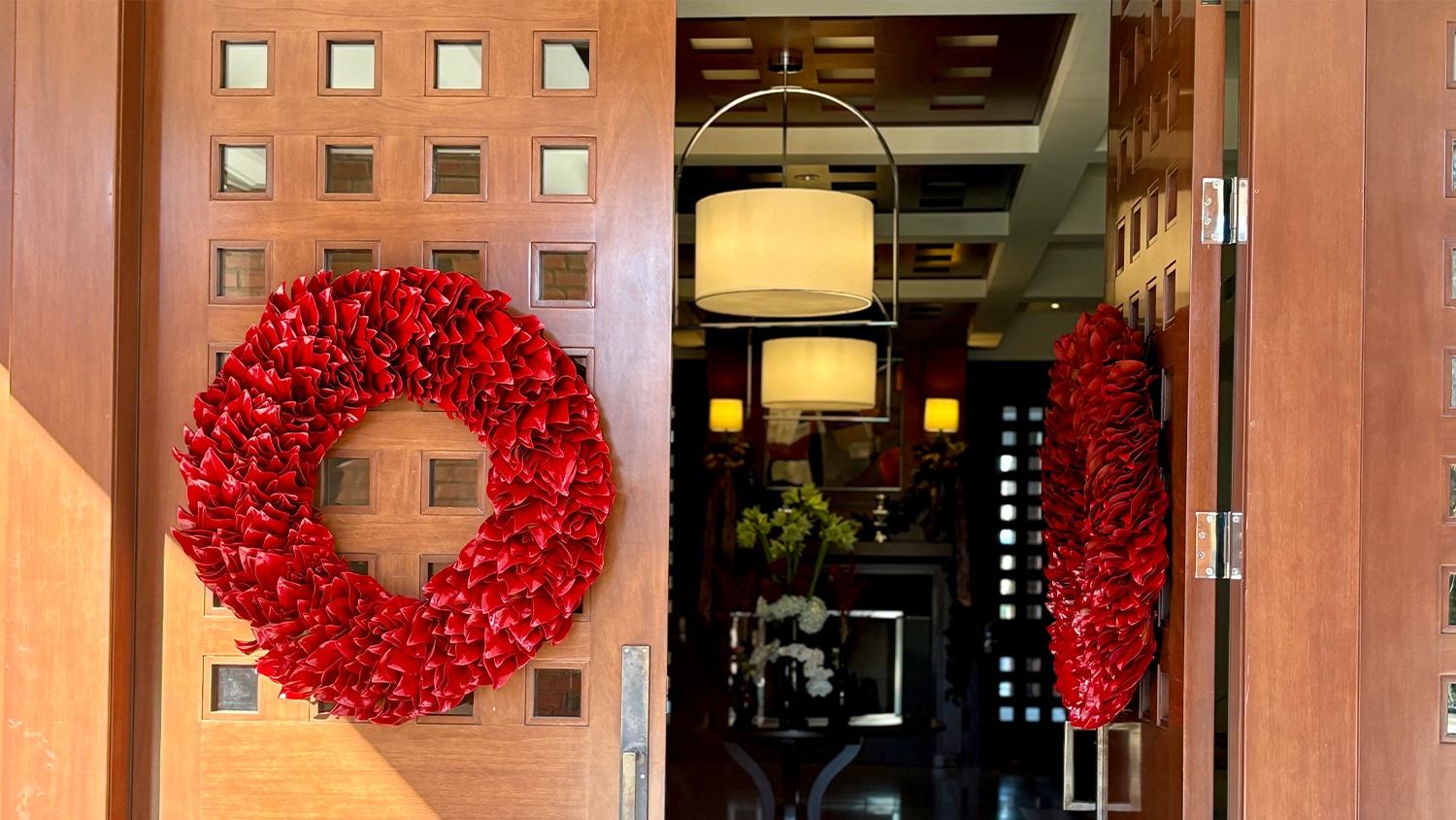Red wreaths hang on the front doors of the chancellor's residence