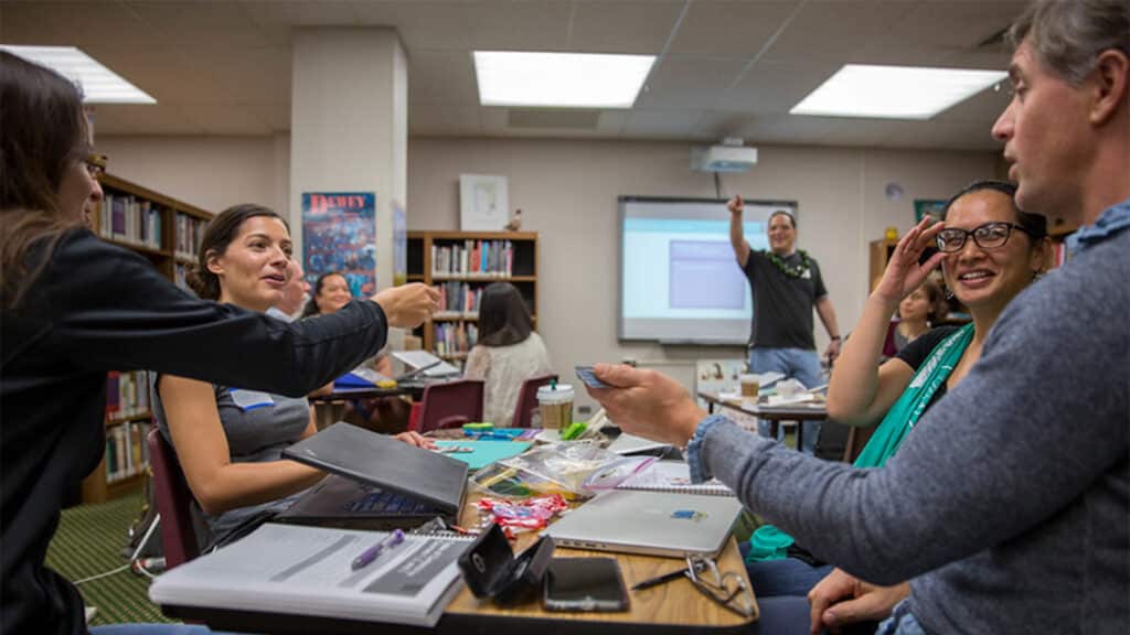 Educators participate in a fun group activity as part of a Code.org training. 