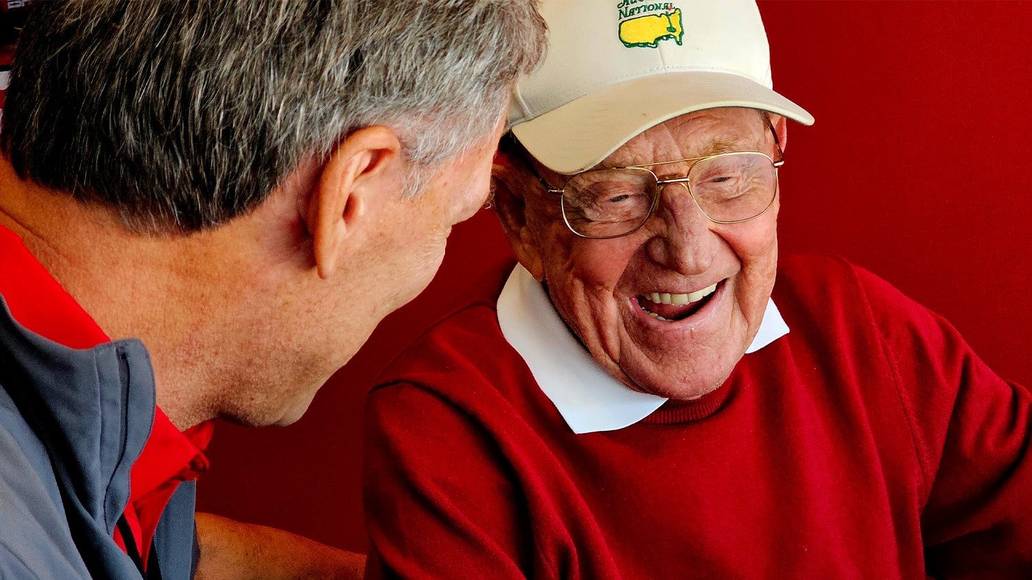 Lou Holtz visits with his former players during a visit to NC State in 2023.