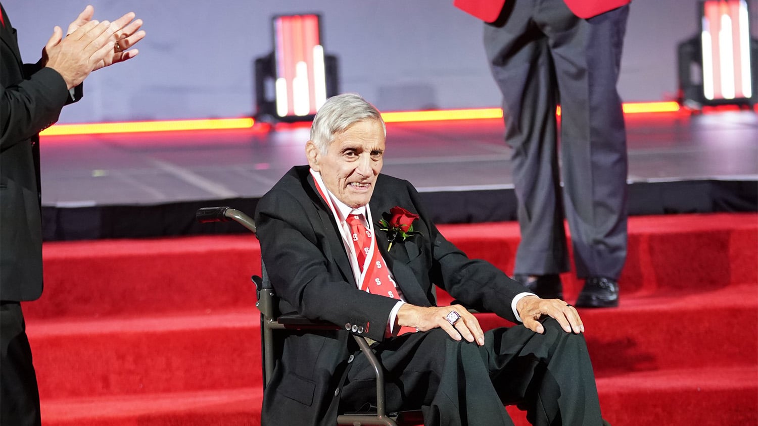 People applaud for Bob Guzzo after he was inducted into the NC State Athletics Hall of Fame