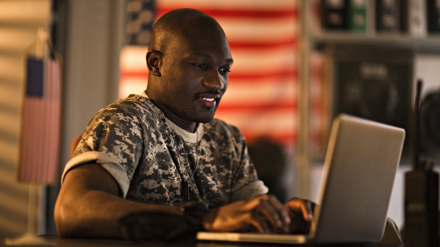 Student veteran works on a laptop
