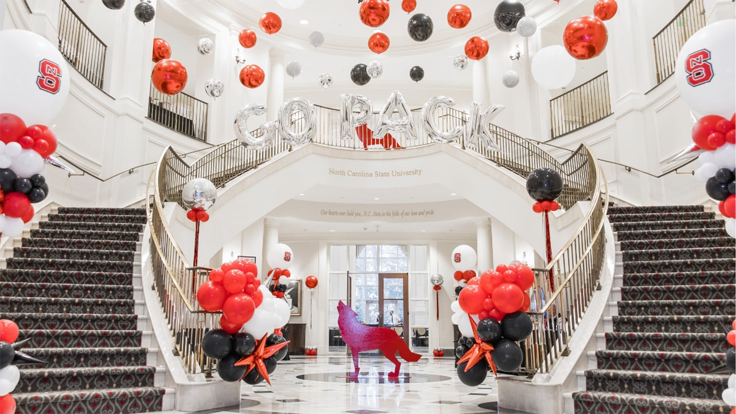 Red, white and black balloons fill the lobby of the Park Alumni Center.